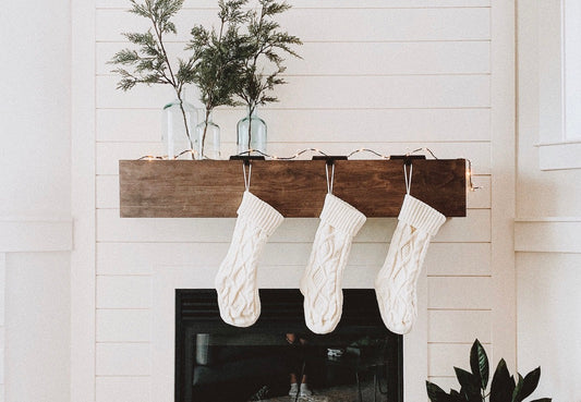 white stockings on wooden mantle fireplace