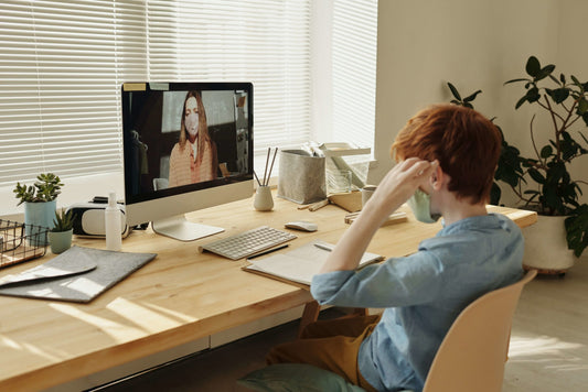 child boy at desk with mask virtual learning