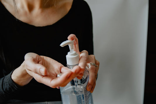 person using hand sanitizer