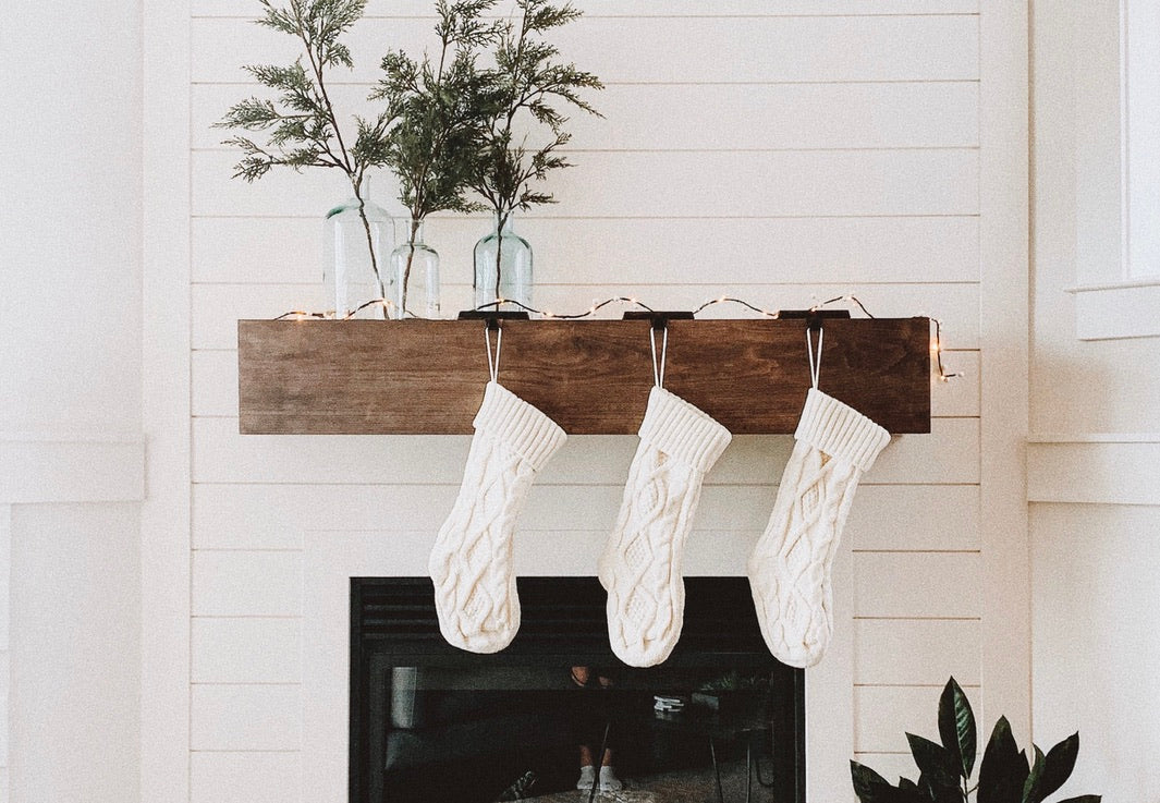 white stockings on wooden mantle fireplace